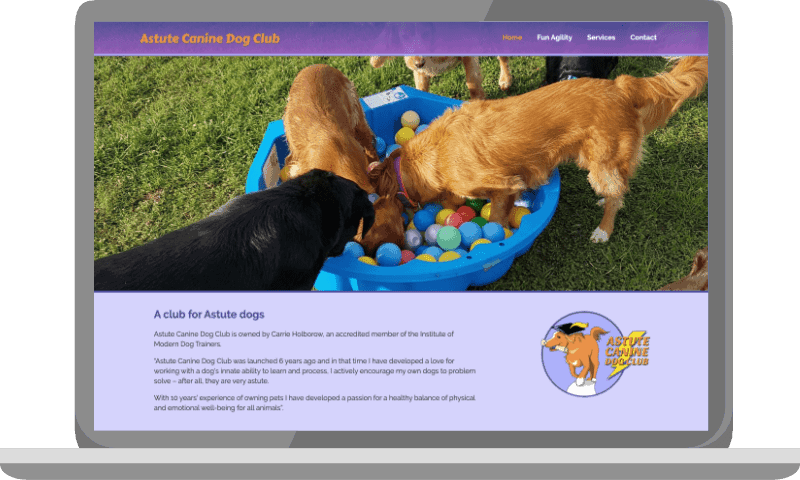 Astute canine dog club website on a laptop